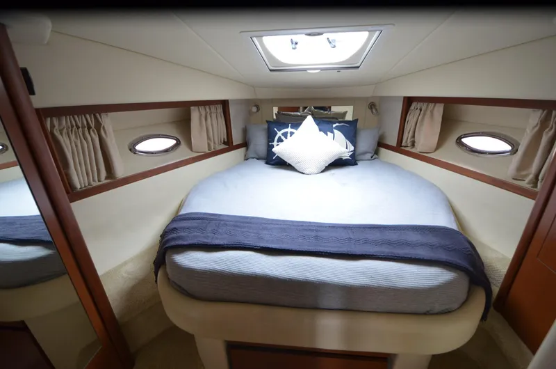 Slide: The Image of Interior of 2007 Sea Ray 38 Sundancer yacht with bathroom and bedroom amenities. - 20