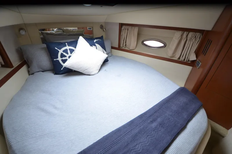 Slide: The Image of 2007 Sea Ray 38 Sundancer bathroom with granite countertop and stainless steel sink. - 23