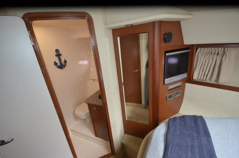 Slide: The Image of 2007 Sea Ray 38 Sundancer yacht kitchen with microwave, fridge, and granite countertops. - 24
