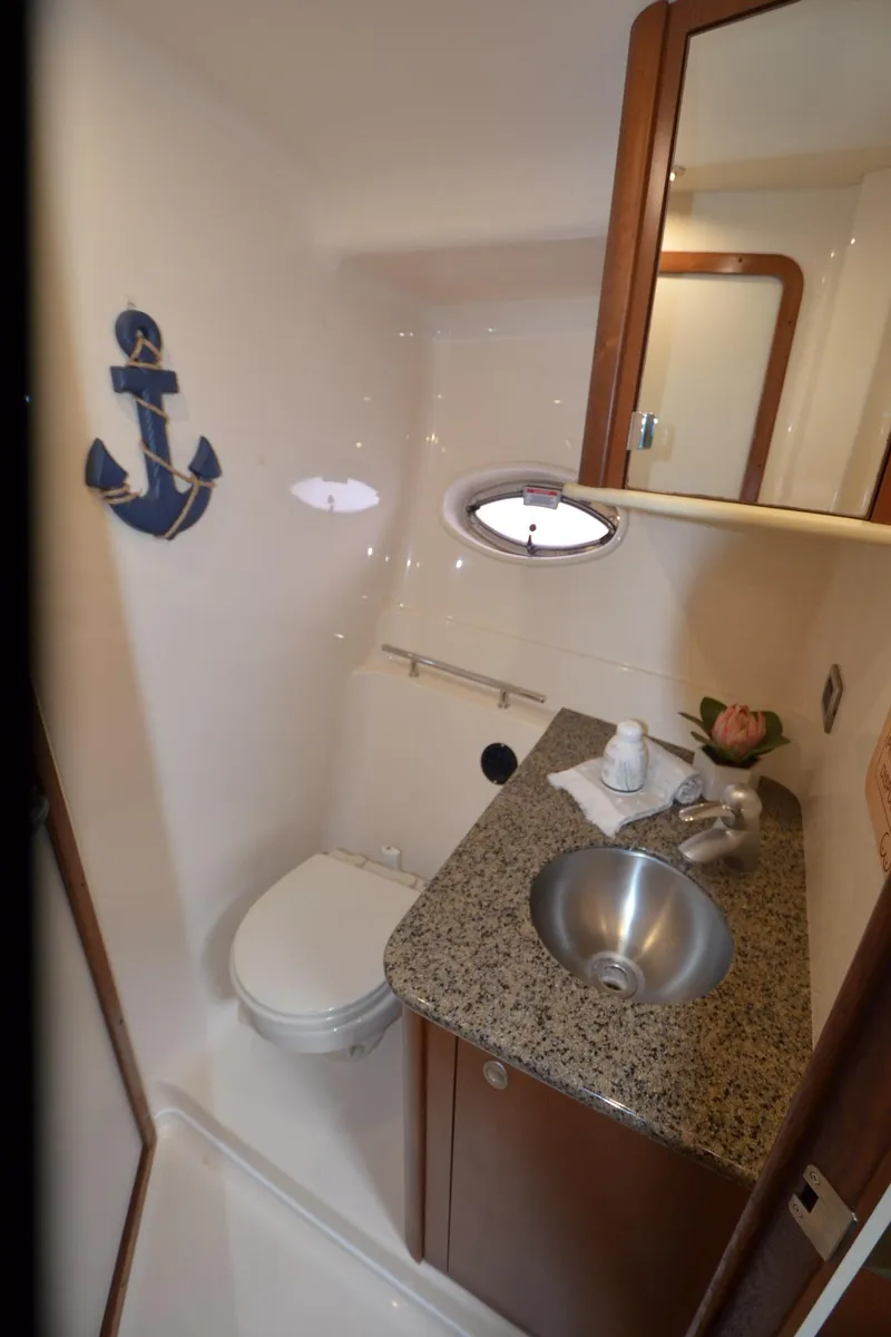 Slide: The Image of Interior of 2007 Sea Ray 38 Sundancer yacht with cozy seating and modern kitchen amenities. - 26