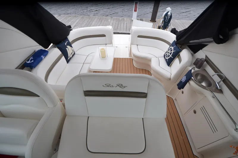 Slide: The Image of 2007 Sea Ray 38 Sundancer yacht docked at a wooden pier. - 3