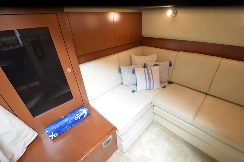 Slide: The Image of Engine room of 2007 Sea Ray 38 Sundancer with visible hoses and wiring. - 32