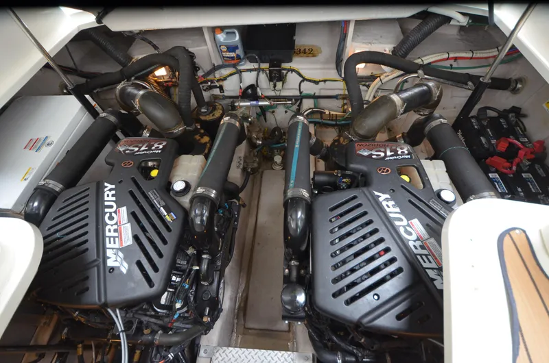 Slide: The Image of Engine room of 2007 Sea Ray 38 Sundancer with control panel and fire extinguisher. - 34