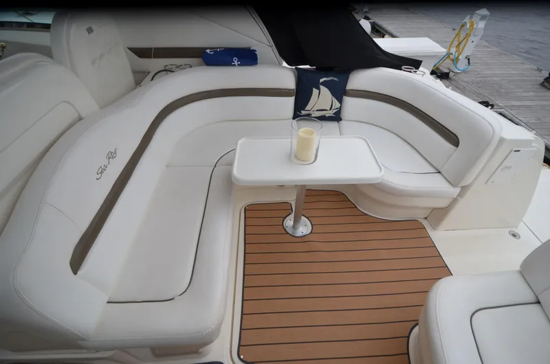 Slide: The Image of 2007 Sea Ray 38 Sundancer helm with white seating and modern controls. - 5