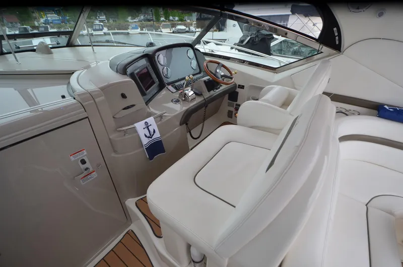 Slide: The Image of 2007 Sea Ray 38 Sundancer interior with sink, wooden flooring, and nautical decor. - 7