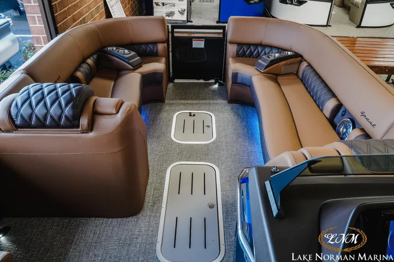Slide: The Image of Luxurious interior of 2026 Bennington 25QSBA pontoon boat with plush seating and modern design. - 15