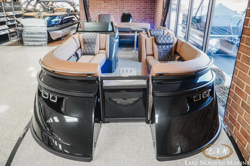 Slide: The Image of 2026 Bennington 25QSBA pontoon boat with luxurious seating at Lake Norman Marina. - 4