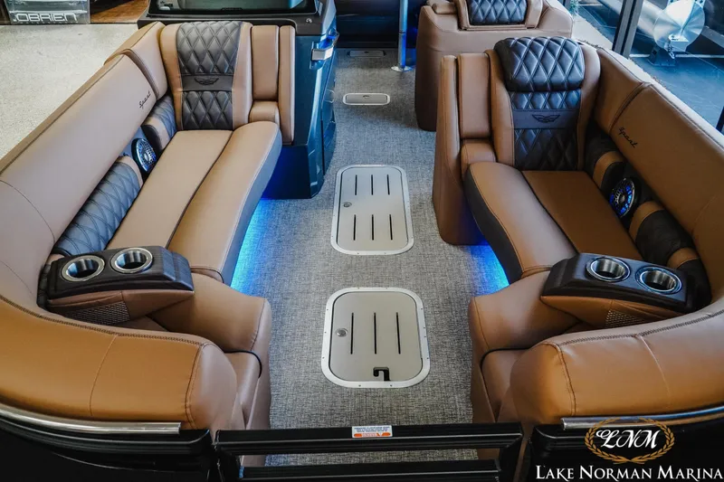 Slide: The Image of Luxurious interior of 2026 Bennington 25QSBA pontoon boat with plush seating and ambient lighting. - 6
