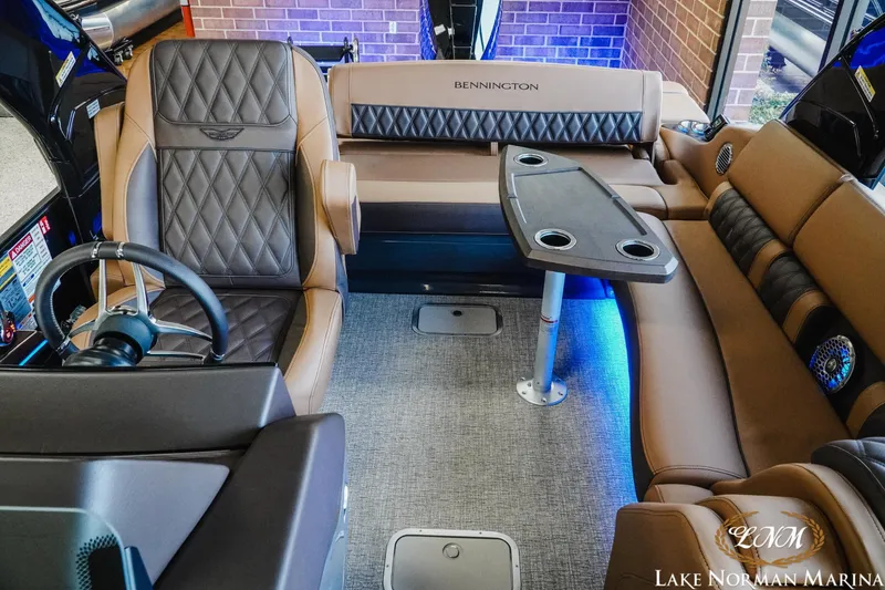 Slide: The Image of Luxurious interior of 2026 Bennington 25QSBA pontoon boat with plush seating and modern amenities. - 8