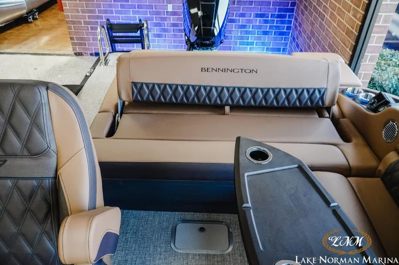 Slide: The Image of Luxurious interior of 2026 Bennington 25QSBA boat with plush seating and elegant design. - 9