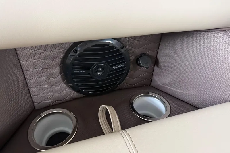 Slide: The Image of 2026 Bentley Pontoons 253 Elite interior with marine-grade speaker and cup holders. - 10
