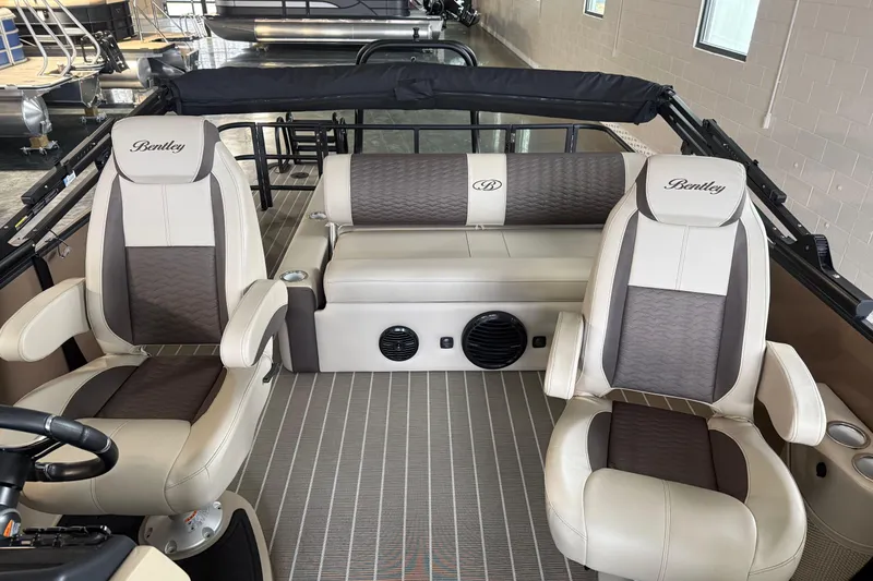 Slide: The Image of 2026 Bentley Pontoons 253 Elite Swingback Dual Capt EXT interior with luxurious seating. - 11