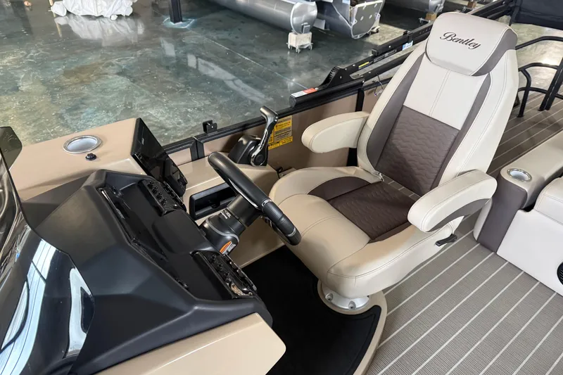 Slide: The Image of 2026 Bentley Pontoons 253 Elite Swingback Dual Capt EXT helm with luxurious captain's chair. - 12