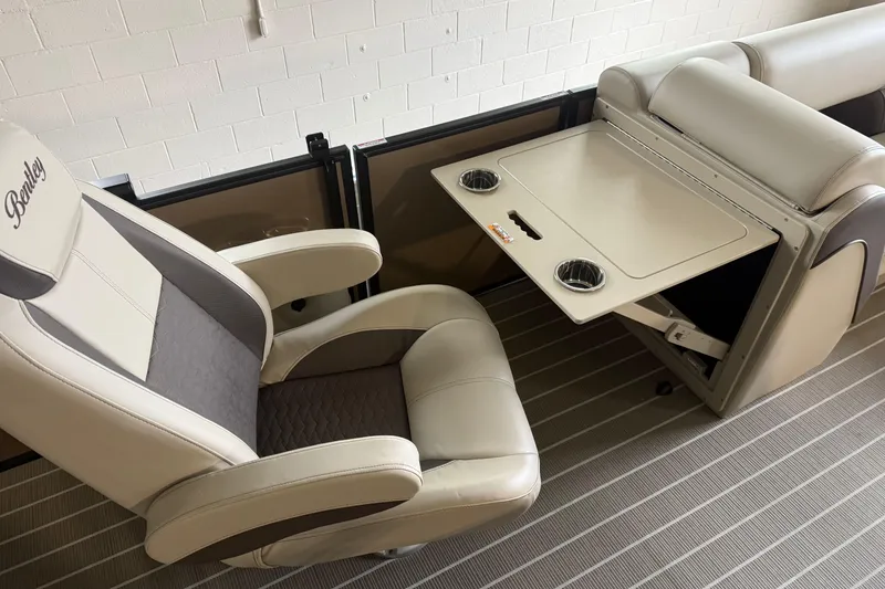 Slide: The Image of Luxurious interior of 2026 Bentley Pontoons 253 Elite, featuring plush seating and a foldable table. - 16