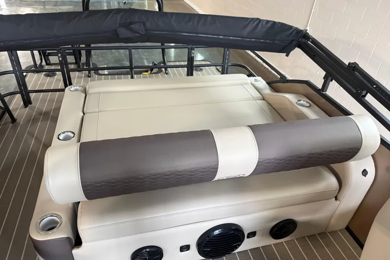 Slide: The Image of 2026 Bentley Pontoons 253 Elite Swingback Dual Capt EXT interior seating with cup holders. - 18