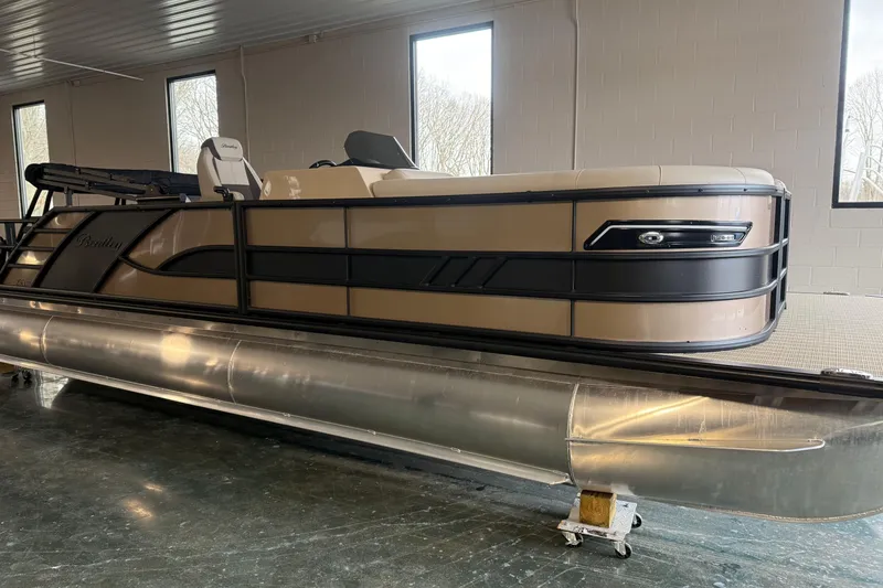The Image of 2026 Bentley Pontoons 253 Elite Swingback Dual Capt EXT in showroom, side view. - 2