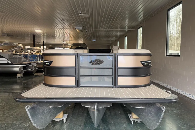 Slide: The Image of 2026 Bentley Pontoons 253 Elite Swingback Dual Capt EXT in showroom, front view. - 4