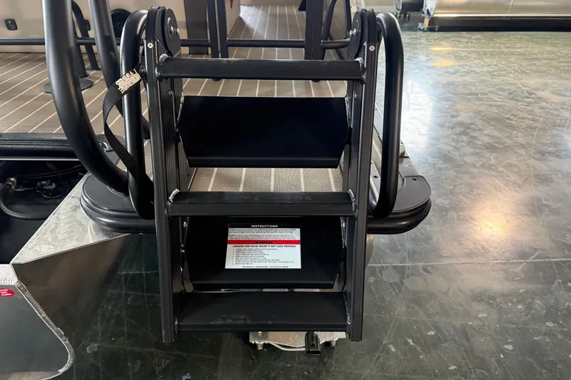 Slide: The Image of 2026 Bentley Pontoons 253 Elite Swingback Dual Capt EXT ladder on showroom floor. - 6