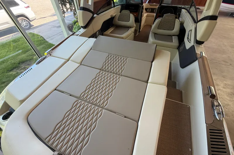 Slide: The Image of 2027 Chris-Craft Sportster 25 interior with luxurious seating and elegant design. - 28