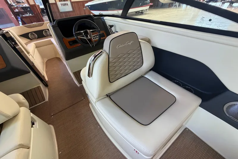 Slide: The Image of Interior of 2027 Chris-Craft Sportster 25, featuring luxurious seating and modern dashboard. - 32