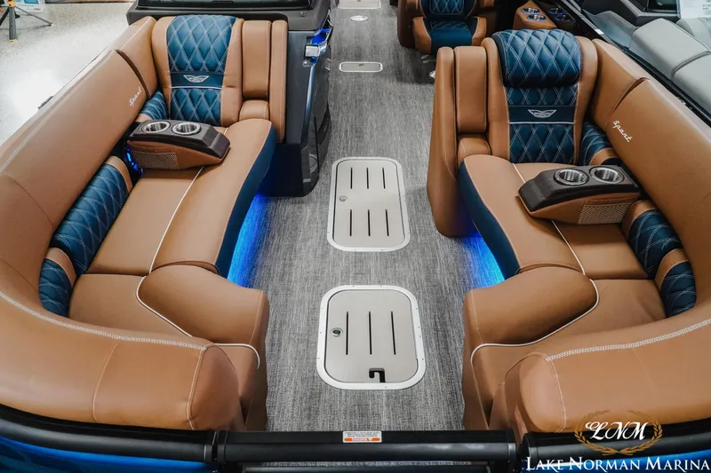 Slide: The Image of Luxurious interior of 2026 Bennington 25QXFBA boat with plush seating and ambient lighting. - 11