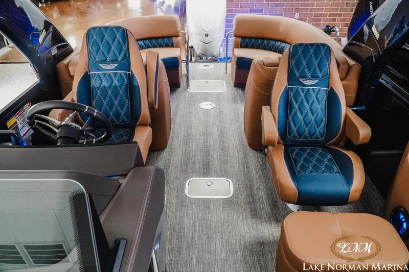 Slide: The Image of Luxurious interior of 2026 Bennington 25QXFBA boat with plush seating and modern design. - 13