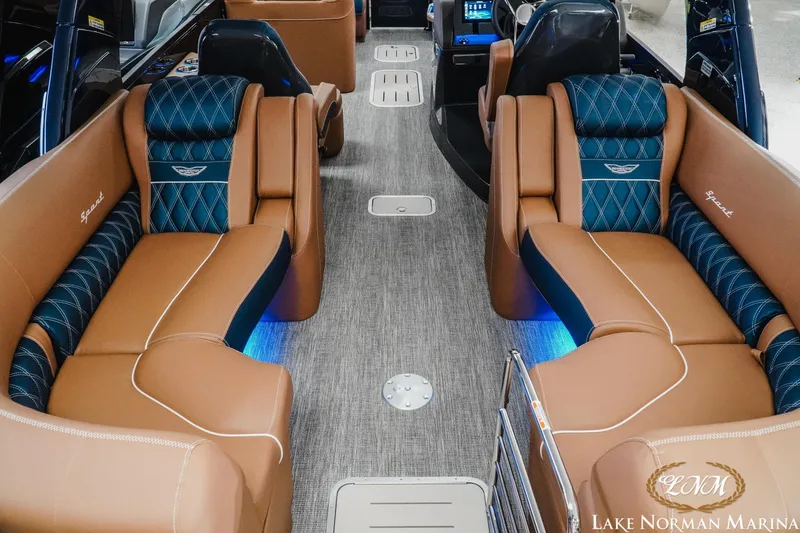 Slide: The Image of Luxurious interior of 2026 Bennington 25QXFBA boat with plush seating and ambient lighting. - 16