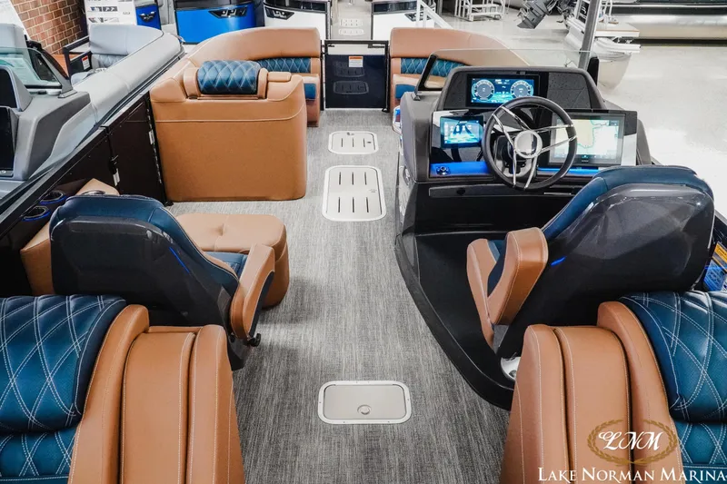 Slide: The Image of Luxurious interior of 2026 Bennington 25QXFBA boat with plush seating and modern dashboard. - 17