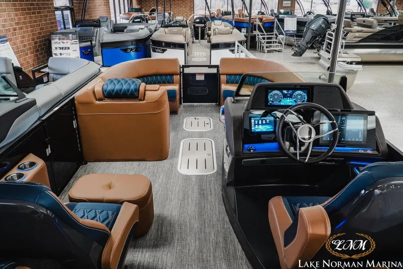 Slide: The Image of Luxurious 2026 Bennington 25QXFBA pontoon boat interior at Lake Norman Marina showroom. - 19