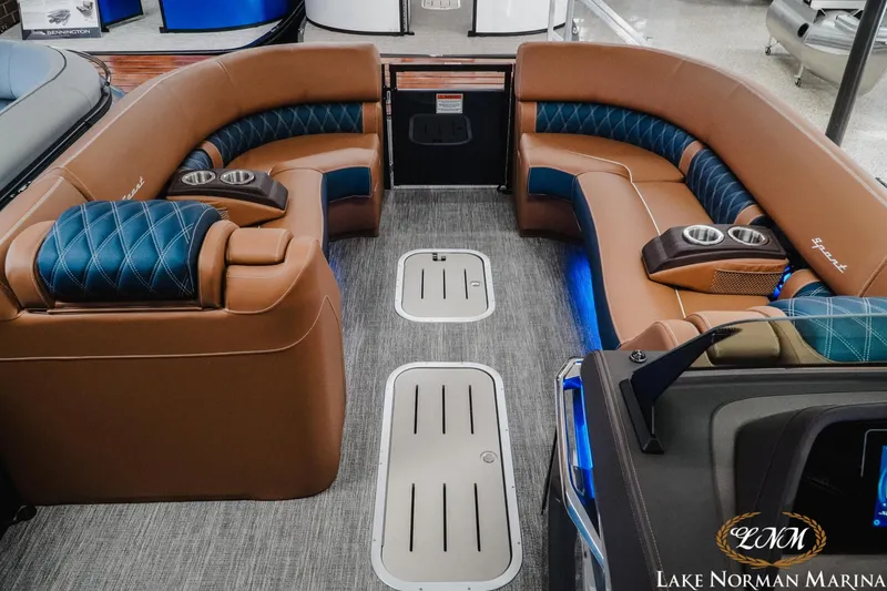 Slide: The Image of Luxurious interior of 2026 Bennington 25QXFBA pontoon boat with plush seating and cup holders. - 20