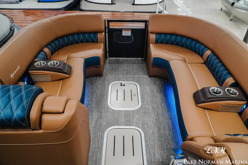 Slide: The Image of Luxurious interior of 2026 Bennington 25QXFBA pontoon boat with plush seating and cup holders. - 21