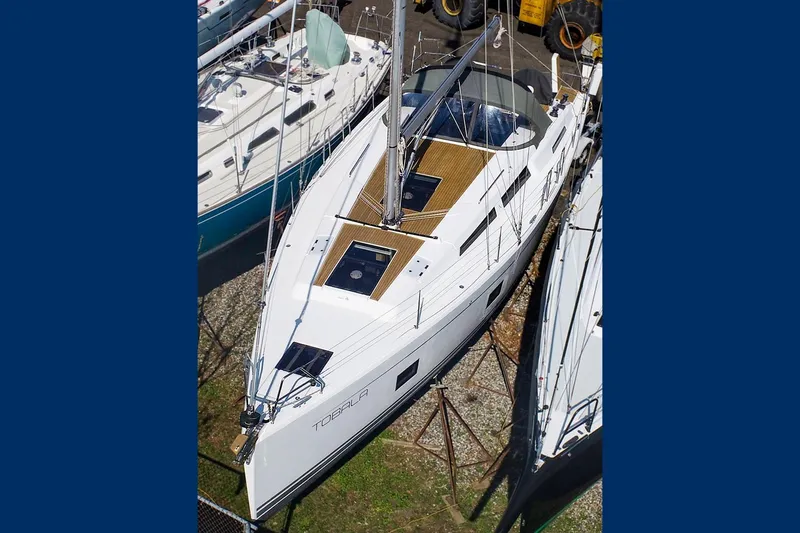 The Image of 2019 Hanse 418 sailboat docked, aerial view showcasing sleek design and deck layout. - 0