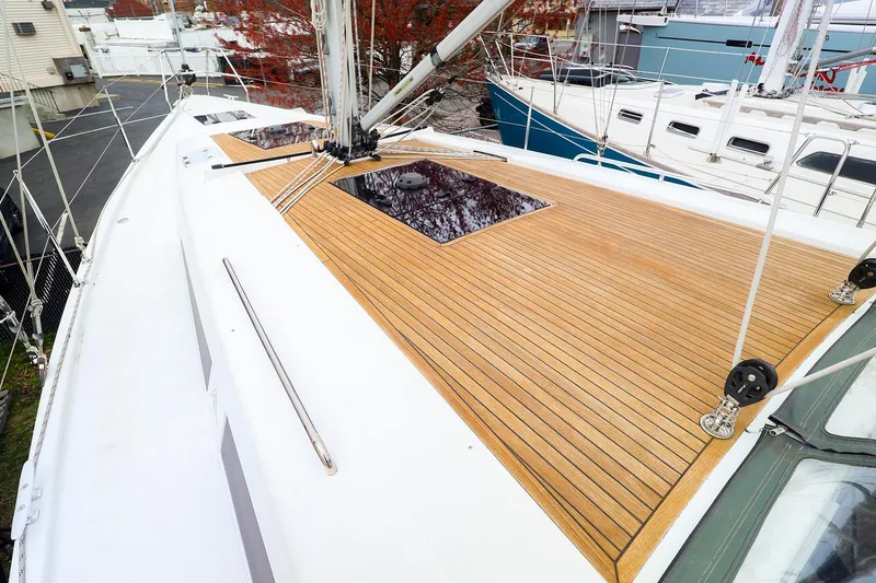 Slide: The Image of 2019 Hanse 418 sailboat deck with teak finish and rigging details. - 14