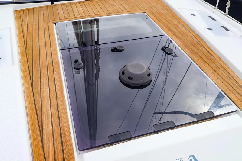 Slide: The Image of Hanse 418 yacht deck with sleek glass hatch and wooden finish, 2019 model. - 16