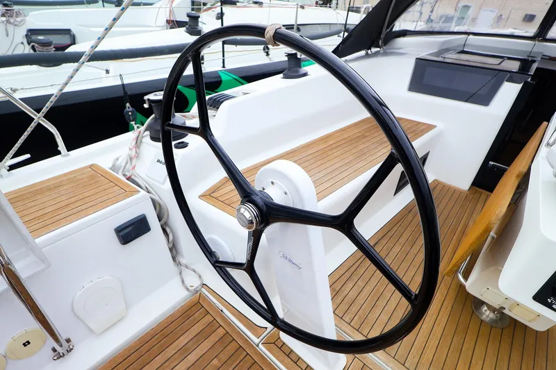 Slide: The Image of Steering wheel of a 2019 Hanse 418 yacht with teak deck. - 2