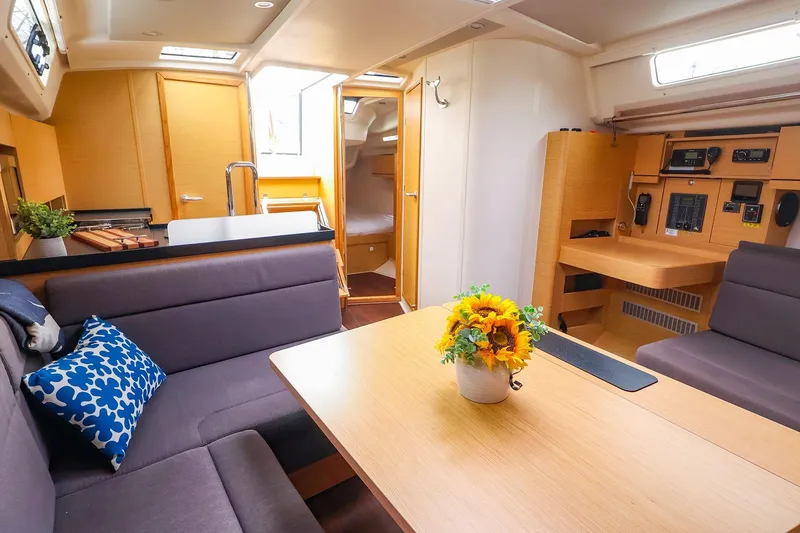 Slide: The Image of Interior of 2019 Hanse 418 yacht with cozy seating and elegant wooden finishes. - 24