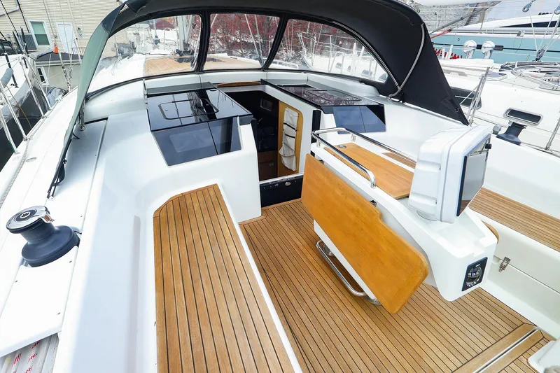 Slide: The Image of 2019 Hanse 418 yacht cockpit with teak flooring and modern helm station. - 3