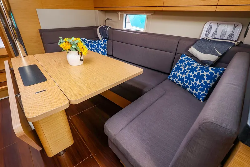 Slide: The Image of Interior of 2019 Hanse 418 yacht with cozy seating and decorative pillows. - 30