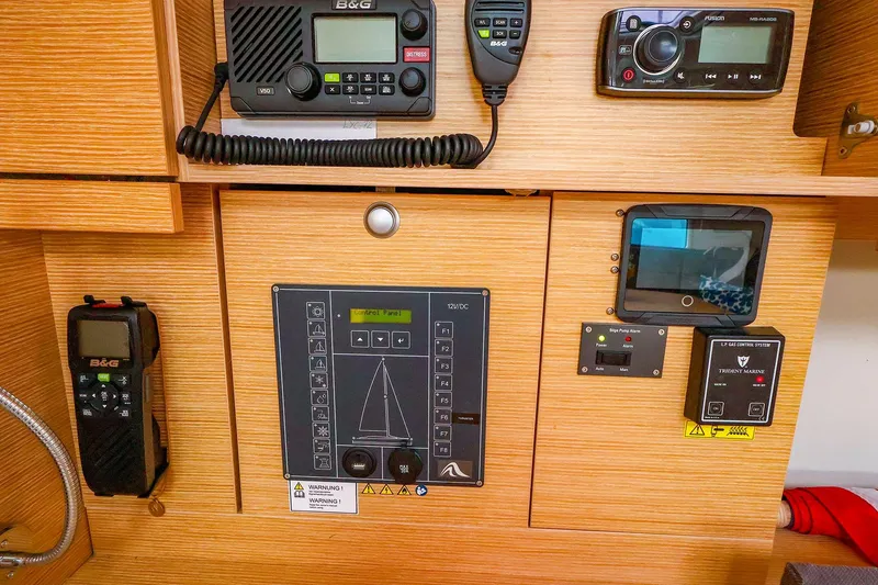Slide: The Image of Control panel of a 2019 Hanse 418 yacht with navigation and communication equipment. - 40