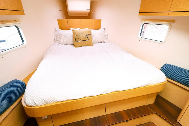 Slide: The Image of Cozy cabin interior of 2019 Hanse 418 yacht with comfortable bed and nautical decor. - 42