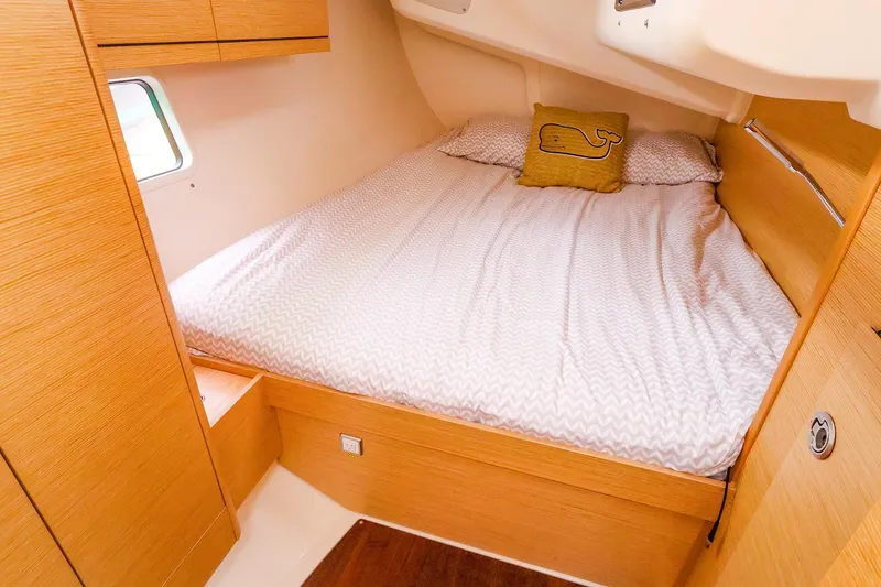 Slide: The Image of Cozy cabin interior of 2019 Hanse 418 yacht with a comfortable bed and wooden finish. - 44