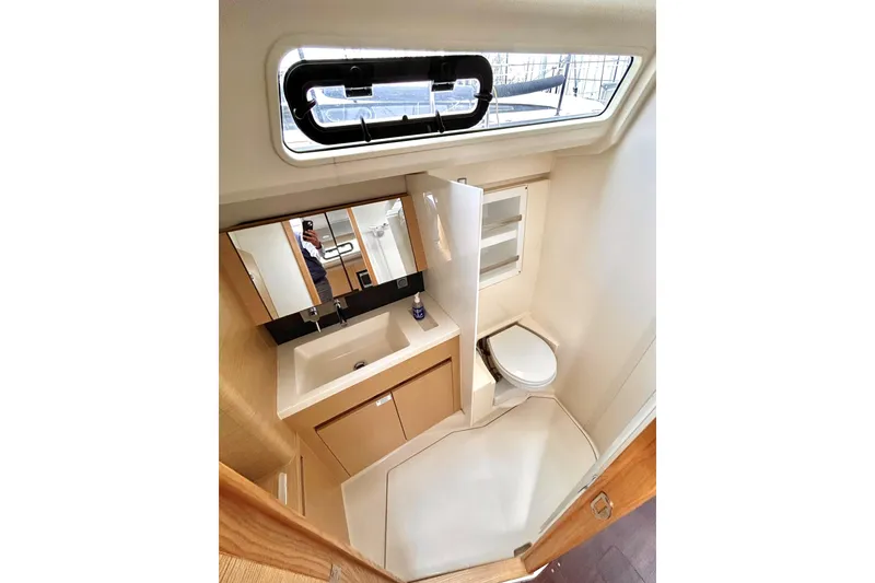 Slide: The Image of Modern bathroom interior of 2019 Hanse 418 yacht with sink, mirror, and toilet. - 45