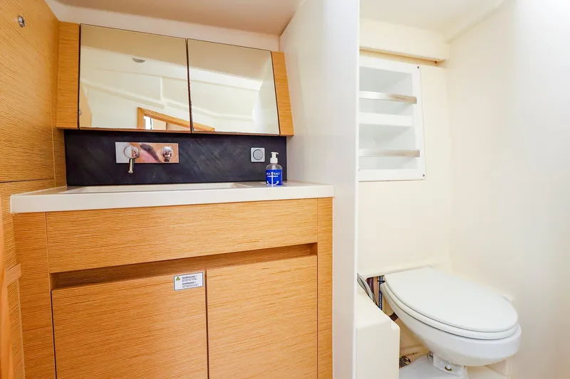 Slide: The Image of Modern bathroom interior of 2019 Hanse 418 yacht with wooden cabinetry and sleek fixtures. - 46