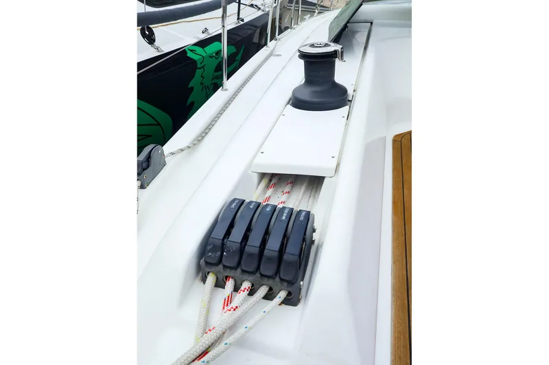 Slide: The Image of Deck view of 2019 Hanse 418 sailboat, featuring winch and rope clutches. - 5