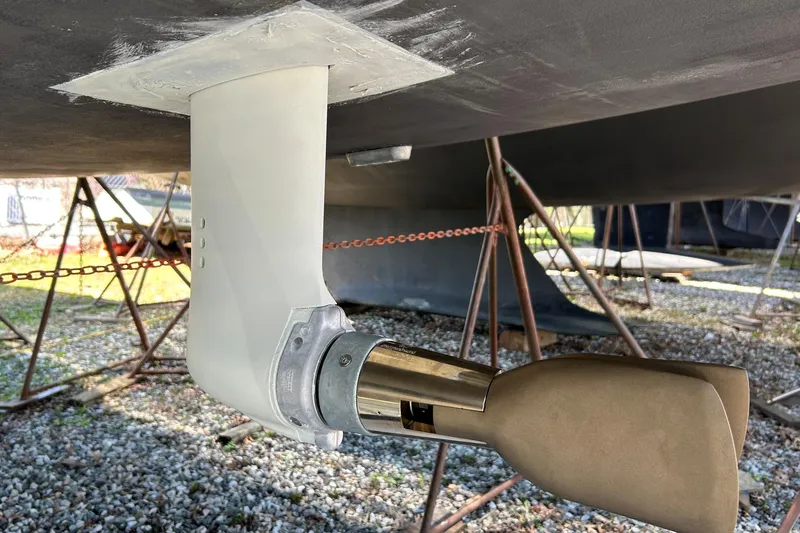 Slide: The Image of 2019 Hanse 418 sailboat propeller and rudder detail in dry dock. - 51