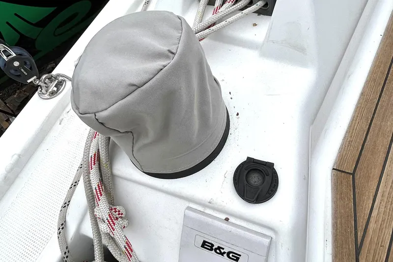 Slide: The Image of Deck of 2019 Hanse 418 sailboat with winch cover and ropes. - 7