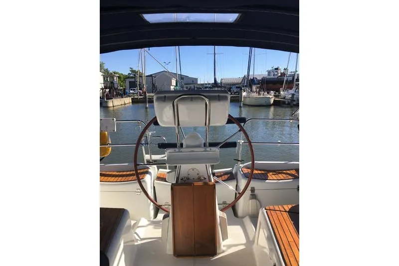 Slide: The Image of Cockpit view of 2007 Jeanneau Sun Odyssey 36i sailboat in marina. - 12