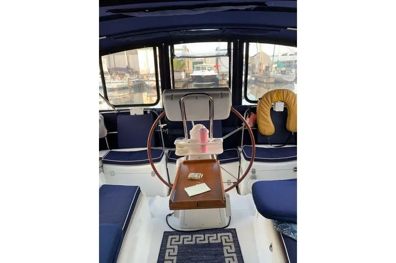 Slide: The Image of Interior view of 2007 Jeanneau Sun Odyssey 36i sailboat cockpit with steering wheel. - 13