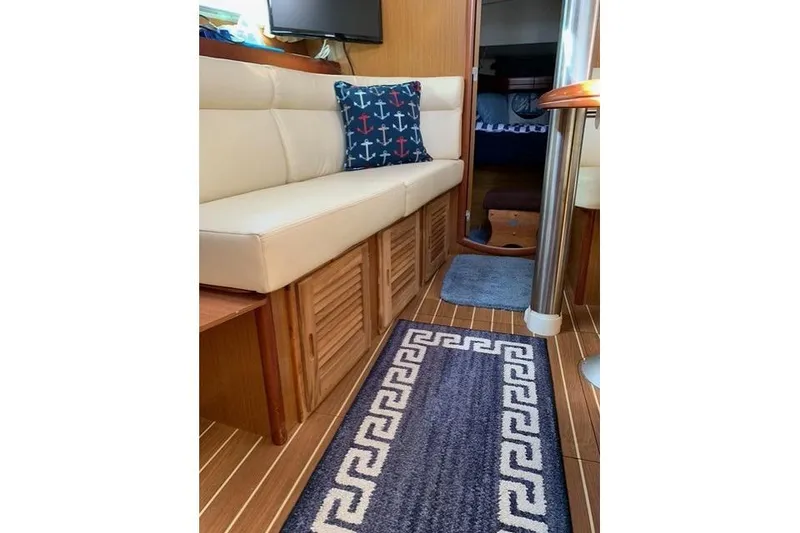 Slide: The Image of Interior of 2007 Jeanneau Sun Odyssey 36i yacht with cozy seating and nautical decor. - 15