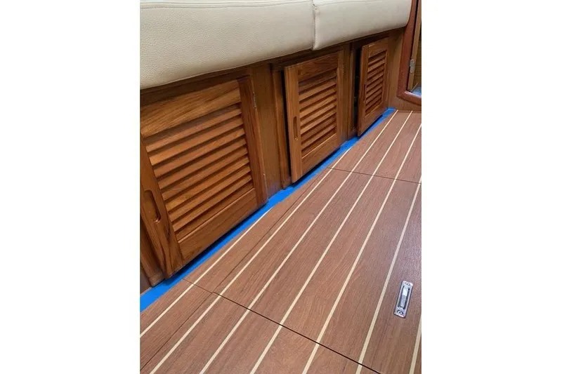 Slide: The Image of Interior of 2007 Jeanneau Sun Odyssey 36i with wooden flooring and cabinets. - 16